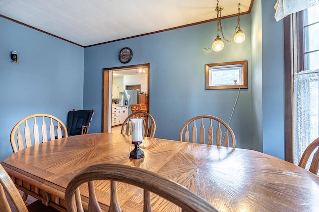 504 Laurel St, Fergus Falls, MN 56537 - dining space featuring crown molding