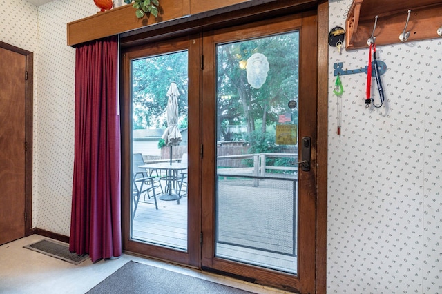 504 Laurel St, Fergus Falls, MN 56537 - doorway to outside featuring wallpapered walls