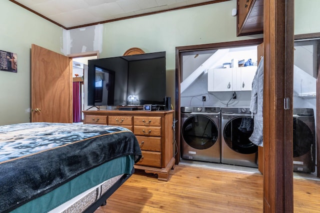 504 Laurel St, Fergus Falls, MN 56537 - bedroom featuring washing machine and clothes dryer, light wood finished floors, and ornamental molding