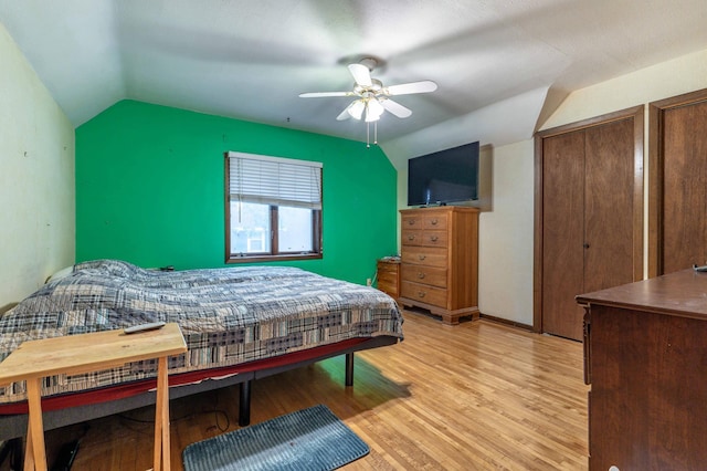 504 Laurel St, Fergus Falls, MN 56537 - bedroom with vaulted ceiling, light wood-style floors, multiple closets, and ceiling fan