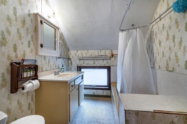 504 Laurel St, Fergus Falls, MN 56537 - bathroom featuring wallpapered walls, curtained shower, vanity, a textured ceiling, and tile patterned flooring