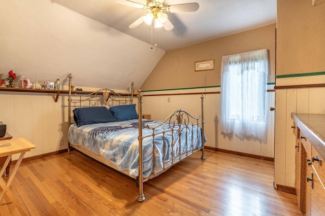504 Laurel St, Fergus Falls, MN 56537 - bedroom with light wood finished floors, lofted ceiling, and ceiling fan