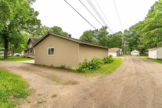 504 Laurel St, Fergus Falls, MN 56537 - view of side of property with a garage