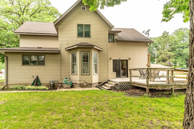 504 Laurel St, Fergus Falls, MN 56537 - back of house featuring a wooden deck, a yard, and roof with shingles