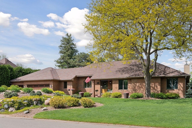 21273 Floral Bay Dr N, Forest Lake, MN 55025 - view of front of property featuring brick siding, a garage, a front yard, and a shingled roof