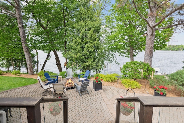 21273 Floral Bay Dr N, Forest Lake, MN 55025 - view of patio / terrace with a fire pit and a water view