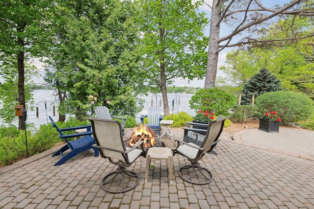 21273 Floral Bay Dr N, Forest Lake, MN 55025 - view of patio / terrace featuring a fire pit and a water view