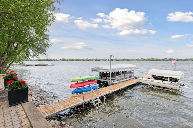 21273 Floral Bay Dr N, Forest Lake, MN 55025 - dock area featuring boat lift and a water view
