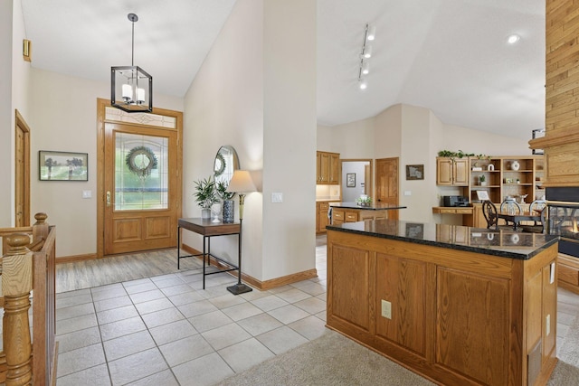 21273 Floral Bay Dr N, Forest Lake, MN 55025 - foyer with rail lighting, light tile patterned floors, and high vaulted ceiling
