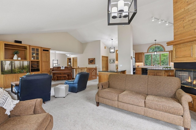 21273 Floral Bay Dr N, Forest Lake, MN 55025 - living area featuring light colored carpet, high vaulted ceiling, and track lighting