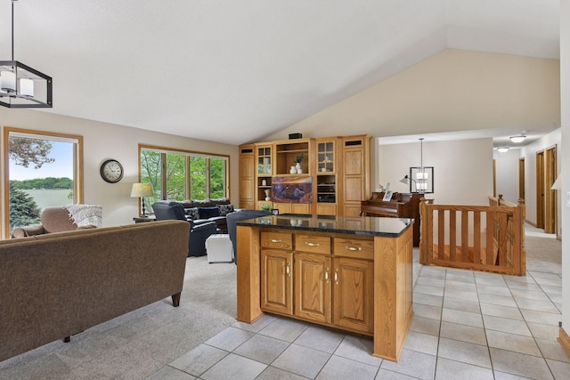 21273 Floral Bay Dr N, Forest Lake, MN 55025 - kitchen featuring lofted ceiling, light carpet, open floor plan, and a kitchen island