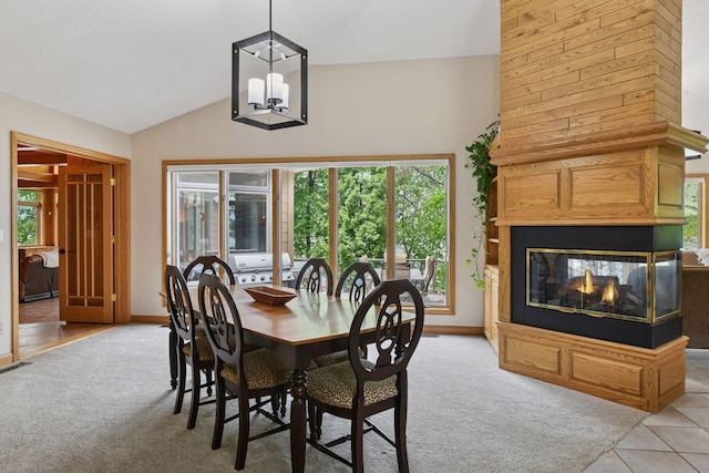 21273 Floral Bay Dr N, Forest Lake, MN 55025 - dining area featuring light carpet, plenty of natural light, a chandelier, and vaulted ceiling