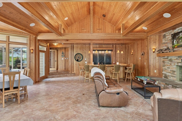 21273 Floral Bay Dr N, Forest Lake, MN 55025 - living area featuring wood walls, wooden ceiling, tile patterned floors, and a stone fireplace