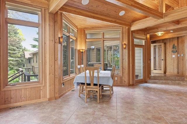 21273 Floral Bay Dr N, Forest Lake, MN 55025 - dining room with healthy amount of natural light, wood walls, a wood ceiling with exposed beams, and tile patterned flooring