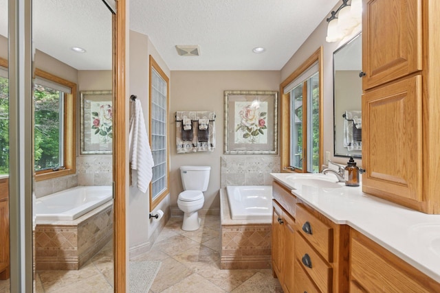 21273 Floral Bay Dr N, Forest Lake, MN 55025 - full bath with a garden tub, double vanity, a textured ceiling, and tile patterned floors