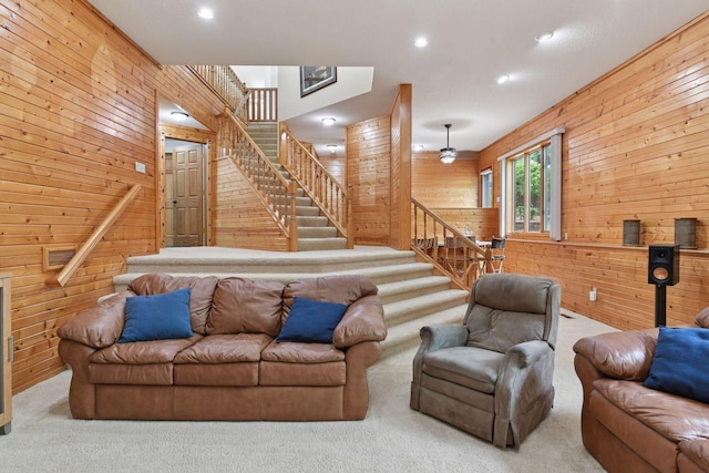 21273 Floral Bay Dr N, Forest Lake, MN 55025 - carpeted living room with wooden walls, stairway, and recessed lighting