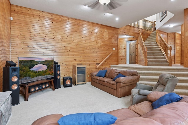 21273 Floral Bay Dr N, Forest Lake, MN 55025 - carpeted living area featuring wooden walls, ceiling fan, and stairway