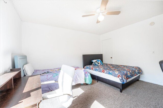 6900 Unity Ave N, Brooklyn Center, MN 55429 - carpeted bedroom with a ceiling fan