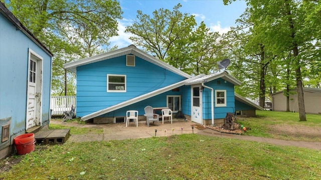 19157 181st Ave, Long Prairie, MN 56347 - rear view of house with a lawn and a patio