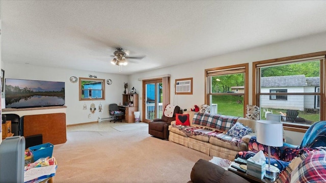 19157 181st Ave, Long Prairie, MN 56347 - carpeted living area with plenty of natural light, a baseboard heating unit, a ceiling fan, a wall unit AC, and a textured ceiling