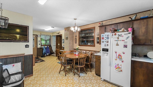 19157 181st Ave, Long Prairie, MN 56347 - kitchen with white refrigerator with ice dispenser, light countertops, and dark brown cabinetry