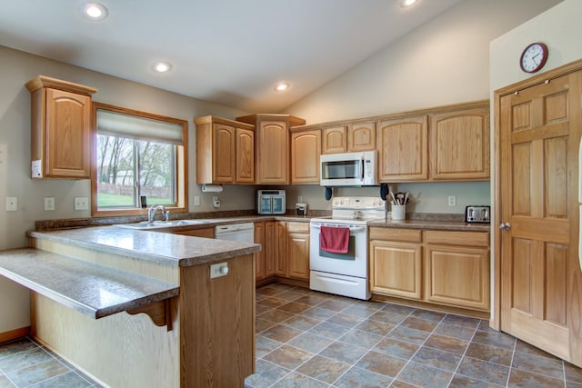 N5024 558th St, Menomonie, WI 54751 - kitchen featuring white appliances, a sink, a peninsula, lofted ceiling, and recessed lighting