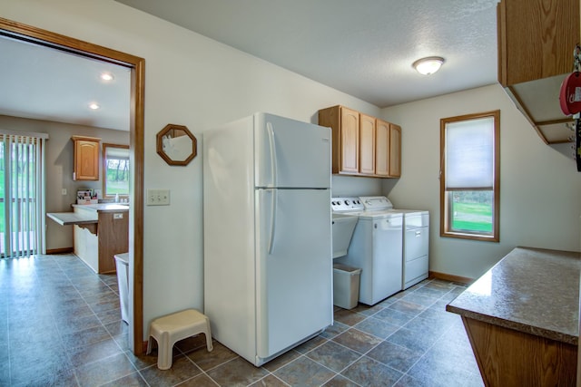 N5024 558th St, Menomonie, WI 54751 - washroom featuring washing machine and dryer, baseboards, a textured ceiling, and recessed lighting