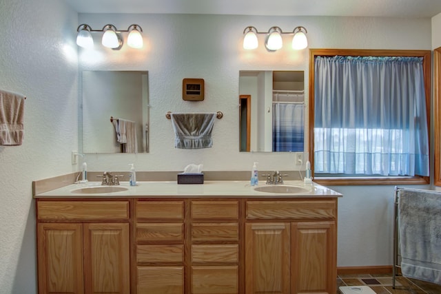 N5024 558th St, Menomonie, WI 54751 - bathroom featuring double vanity and a textured wall