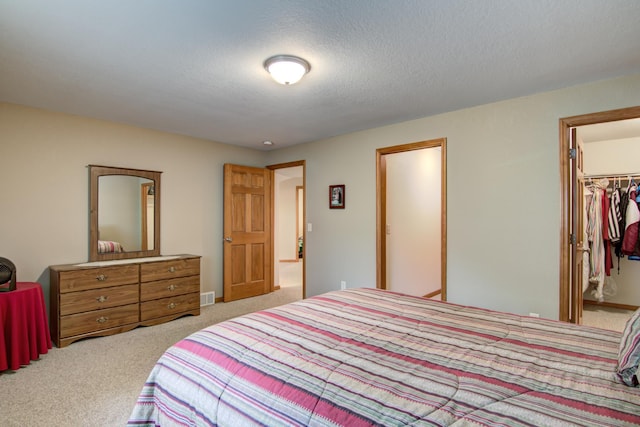 N5024 558th St, Menomonie, WI 54751 - bedroom featuring carpet flooring, a spacious closet, and a closet