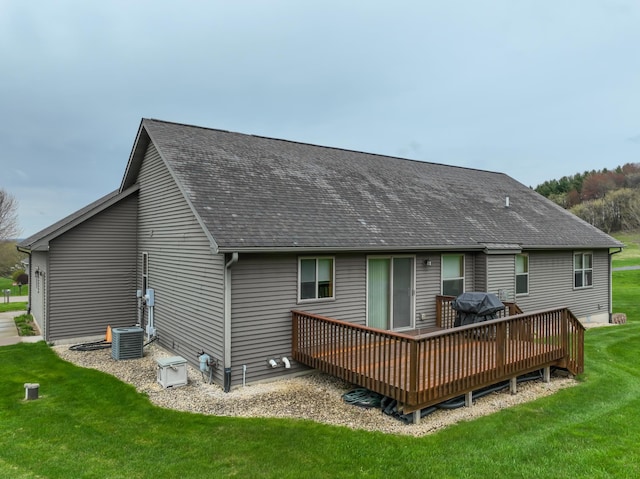 N5024 558th St, Menomonie, WI 54751 - rear view of property featuring a deck, a lawn, and roof with shingles