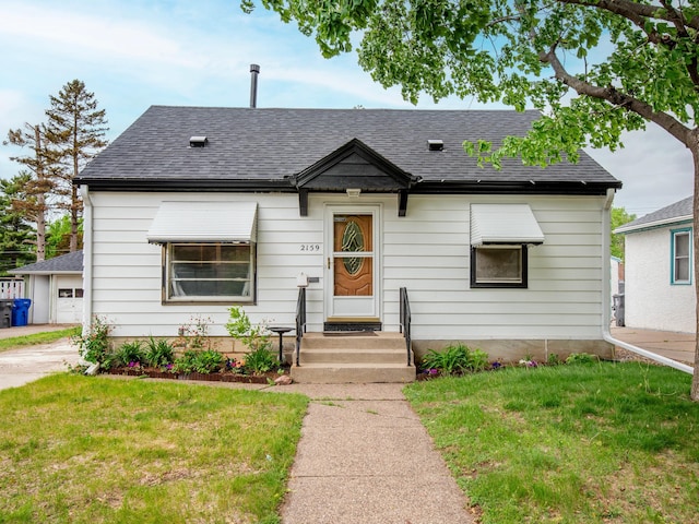 2159 Nortonia Ave, Saint Paul, MN 55119 - view of front facade featuring roof with shingles and a front yard
