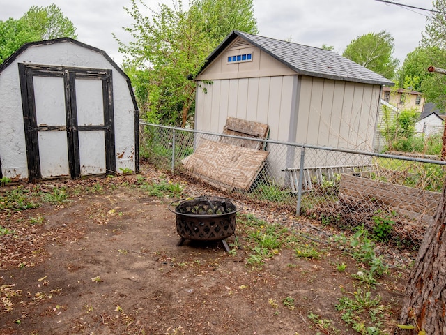 2159 Nortonia Ave, Saint Paul, MN 55119 - view of shed with fence and an outdoor fire pit