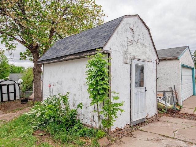 2159 Nortonia Ave, Saint Paul, MN 55119 - view of shed featuring a garage and fence
