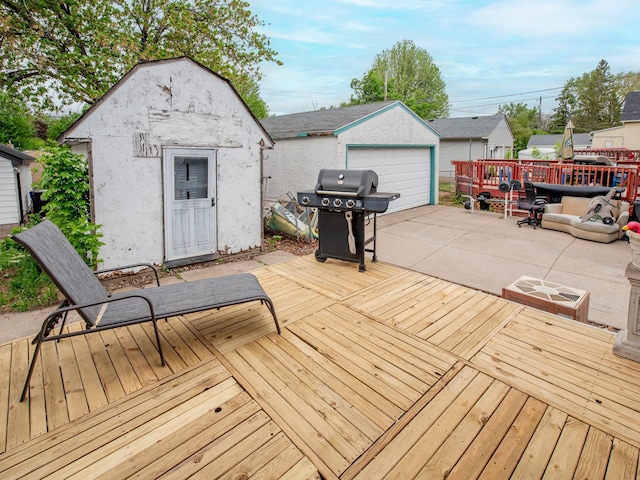 2159 Nortonia Ave, Saint Paul, MN 55119 - deck with grilling area, an outbuilding, and a detached garage