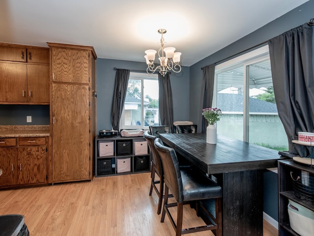 2159 Nortonia Ave, Saint Paul, MN 55119 - dining space featuring a chandelier and light wood-style flooring