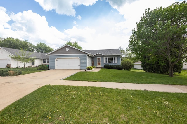 ranch-style home featuring an attached garage, a front lawn, and driveway