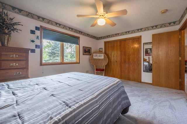 bedroom with light colored carpet and ceiling fan