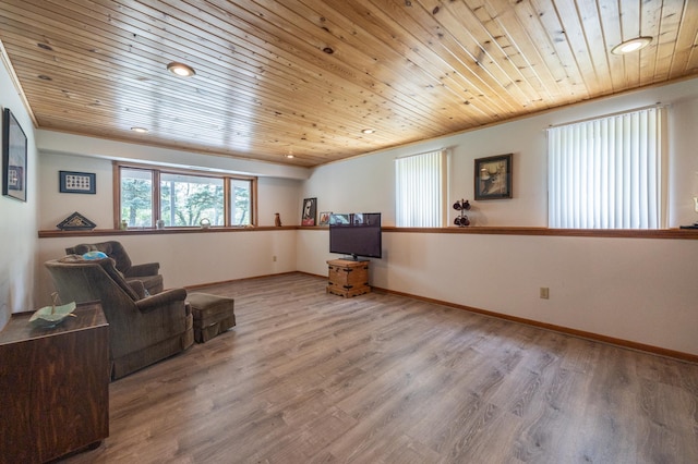 living area with wooden ceiling and wood finished floors