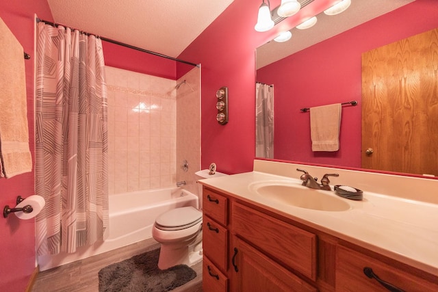 full bathroom featuring vanity, shower / bath combo with shower curtain, toilet, and wood finished floors