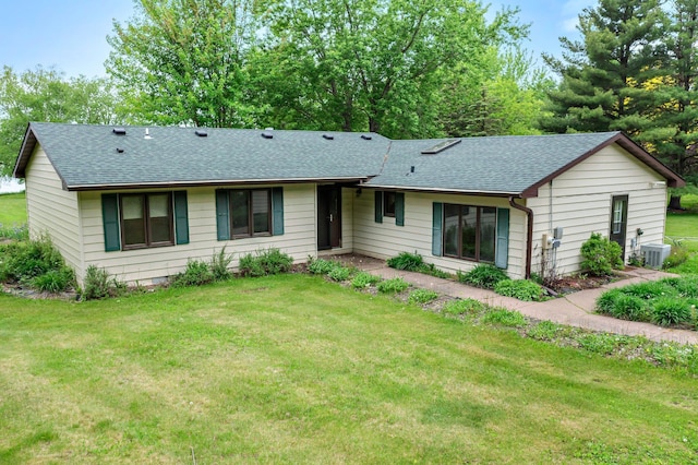 1242 4 1/4 St, Almena, WI 54805 - ranch-style home featuring a shingled roof, cooling unit, and a front yard