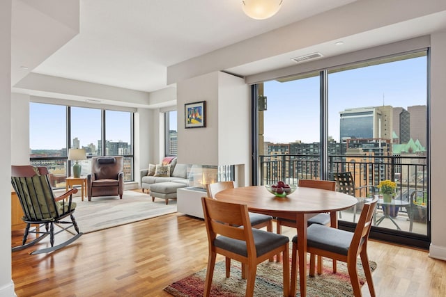 100 3rd Ave S Unit 1107, Minneapolis, MN 55401 - dining area with plenty of natural light, light wood-type flooring, and a view of city