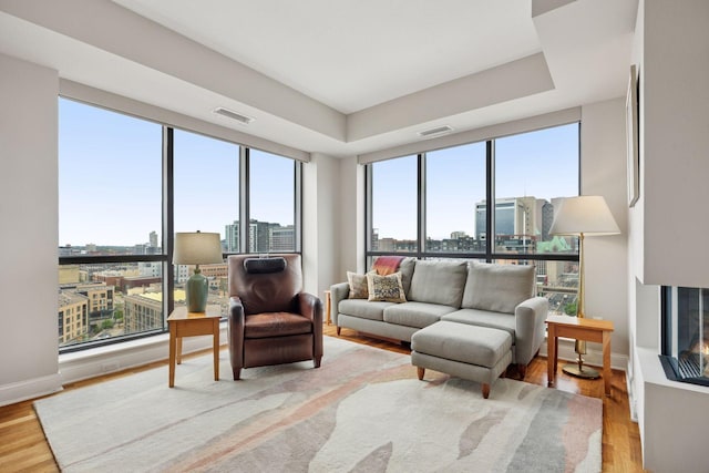 100 3rd Ave S Unit 1107, Minneapolis, MN 55401 - living area with a view of city, light wood-style floors, and baseboards