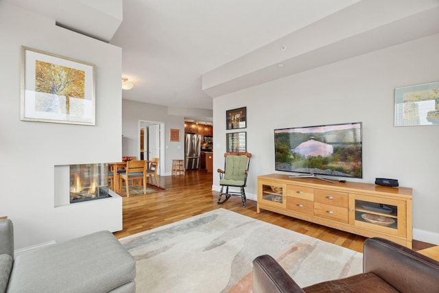 100 3rd Ave S Unit 1107, Minneapolis, MN 55401 - living room featuring wood finished floors and baseboards