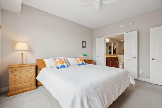 100 3rd Ave S Unit 1107, Minneapolis, MN 55401 - bedroom with carpet flooring, connected bathroom, baseboards, and a ceiling fan