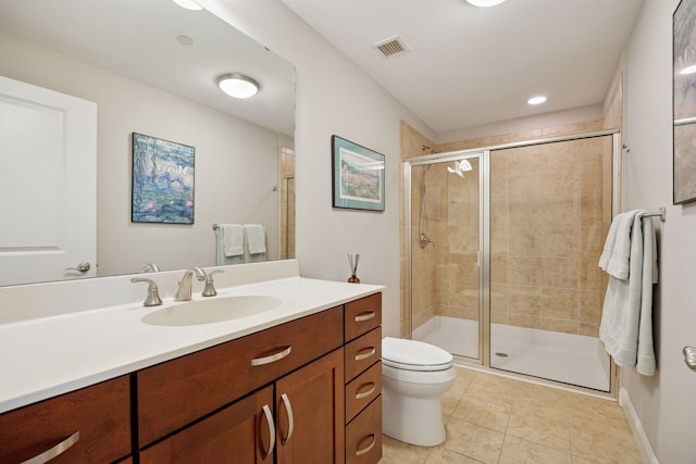 100 3rd Ave S Unit 1107, Minneapolis, MN 55401 - bathroom featuring vanity, toilet, a shower stall, and tile patterned floors