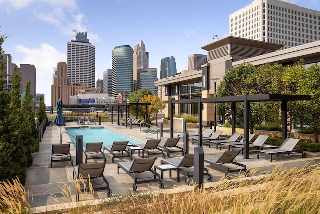 100 3rd Ave S Unit 1107, Minneapolis, MN 55401 - community pool featuring a view of skyline and a patio