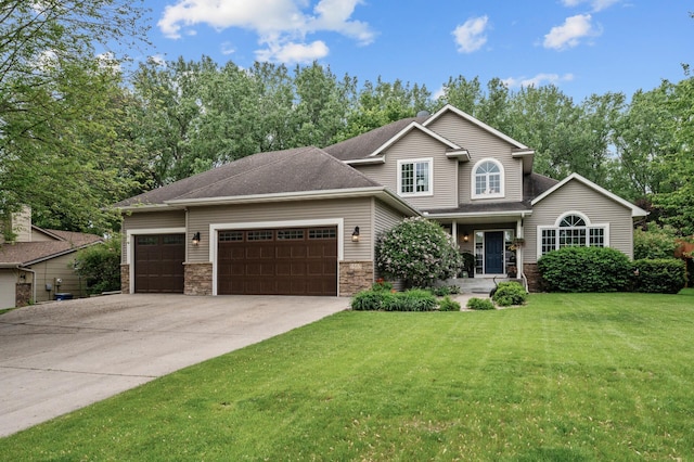 1665 3rd St SW, New Brighton, MN 55112 - view of front of home with an attached garage, concrete driveway, a front yard, covered porch, and stone siding