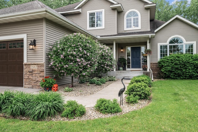 1665 3rd St SW, New Brighton, MN 55112 - view of front of home with stone siding, roof with shingles, a front yard, and an attached garage