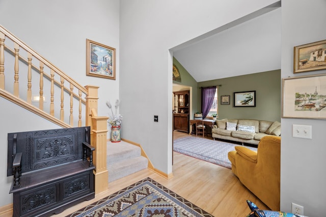 1665 3rd St SW, New Brighton, MN 55112 - entryway with wood finished floors, stairway, high vaulted ceiling, and baseboards