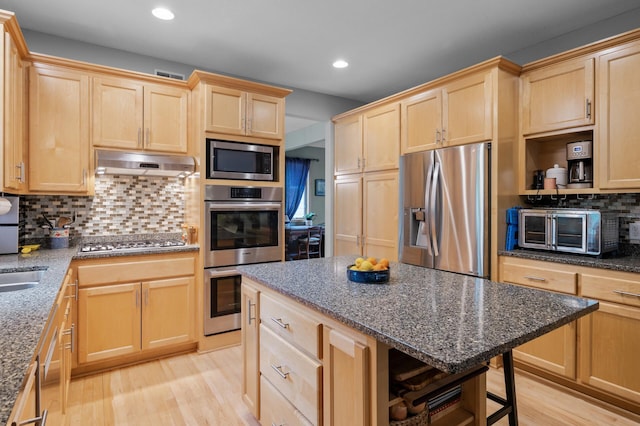 1665 3rd St SW, New Brighton, MN 55112 - kitchen with appliances with stainless steel finishes, light brown cabinets, under cabinet range hood, open shelves, and light wood-style floors